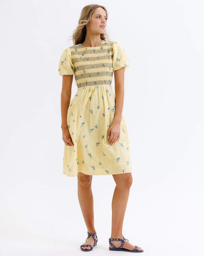 Downeast Best Buds Dress featuring a colorful floral pattern, sleeveless design, and flowy fabric perfect for casual wear.