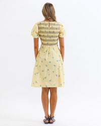 Downeast Best Buds Dress in floral print, sleeveless design with ruffled hem, perfect for casual summer wear.