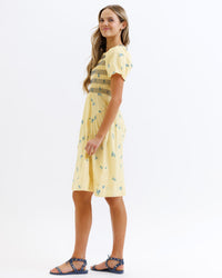 Downeast Best Buds Dress displayed on a hanger, featuring a floral print and lightweight fabric perfect for casual wear.