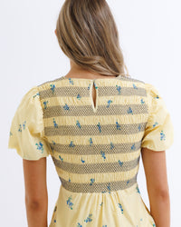 Downeast Best Buds Dress featuring a floral pattern and lightweight fabric, displayed on a hanger.
