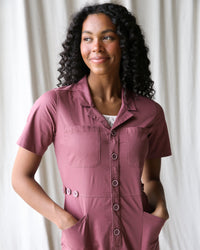 Downeast crushed berry utility jumpsuit featuring a relaxed fit, front pockets, and adjustable straps for casual wear.