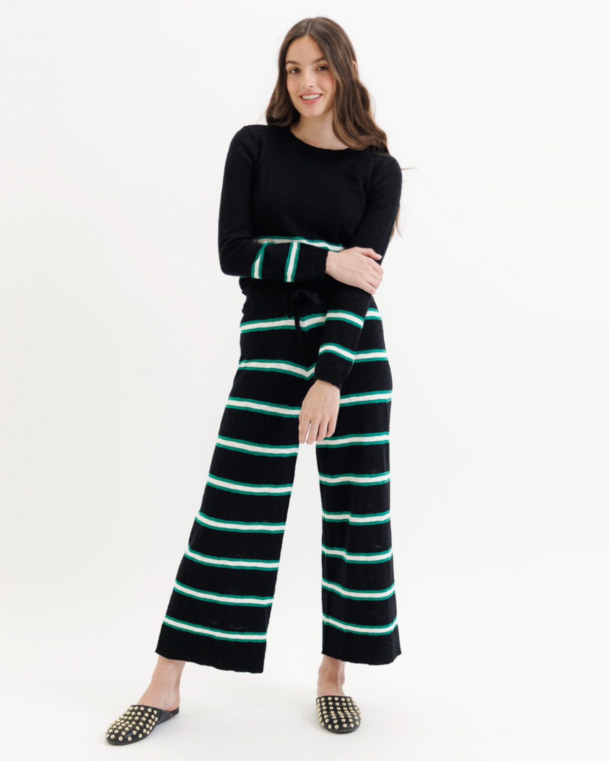 Black Round Trip Pants by Downeast with a pop stripe pattern, shown in a close-up view of the fabric and waistband.