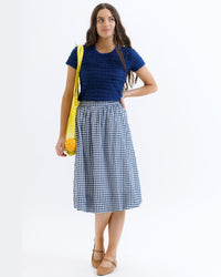 Navy check bubble skirt by Downeast, showing a high-waisted, gathered design with a playful, voluminous silhouette.