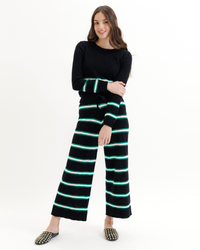Black Downeast Round Trip Long Sleeve Crew sweater with a pop stripe design, featuring a cozy crew neck and long sleeves.