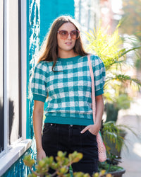 Green plaid Downeast Prima Sweater with a classic crew neckline, displayed on a neutral background.