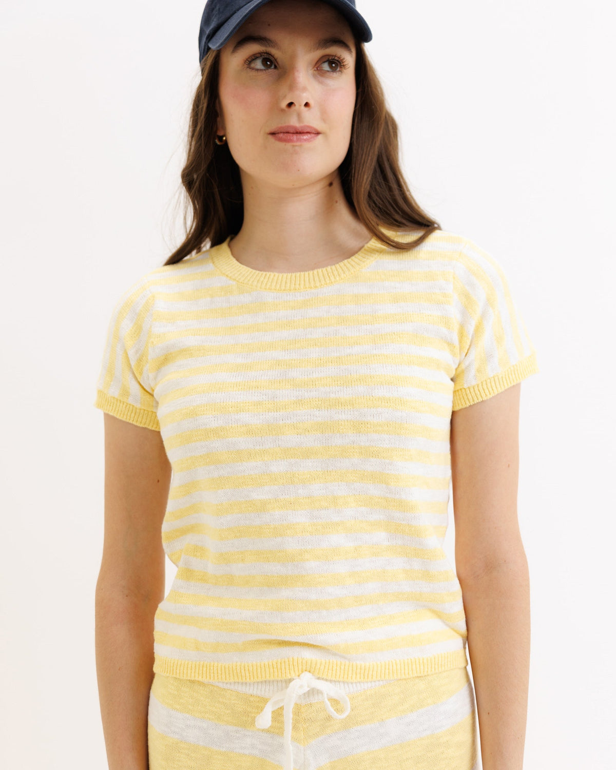 Yellow striped Downeast Round Trip Crew sweater, crewneck style, with visible ribbed cuffs and hem, soft and cozy knit fabric.