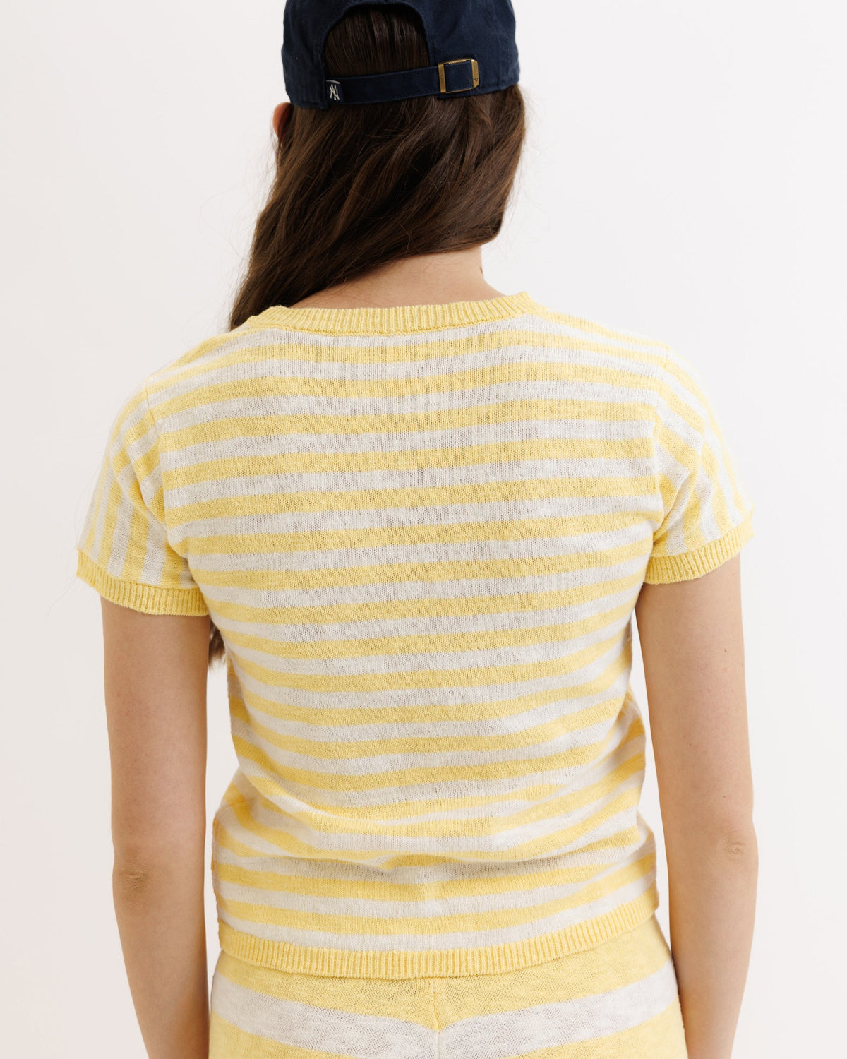 Yellow striped Downeast Round Trip Crew sweater, cozy knit crewneck with casual style, shown on a model.
