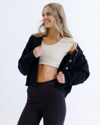Black Downeast Contour Demi Tee displayed on a white background, showcasing its relaxed fit and soft fabric.