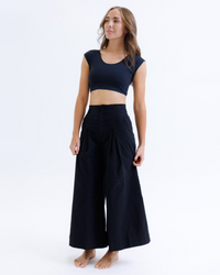 Black Downeast Contour Demi Tee displayed on a hanger, showing its fitted, casual style and soft fabric.