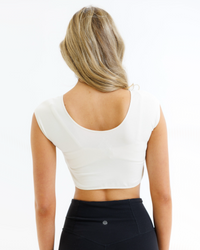 White Downeast Demi Tee in size XS displayed flat, showcasing its soft fabric and classic crew neckline.