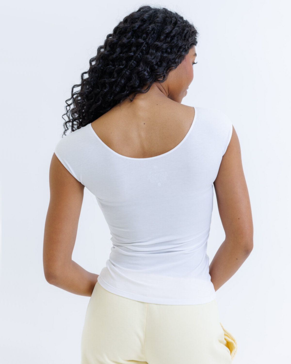 White Downeast Essential Tee, XS size, soft cotton fabric, displayed flat showing classic crew neck and short sleeves.