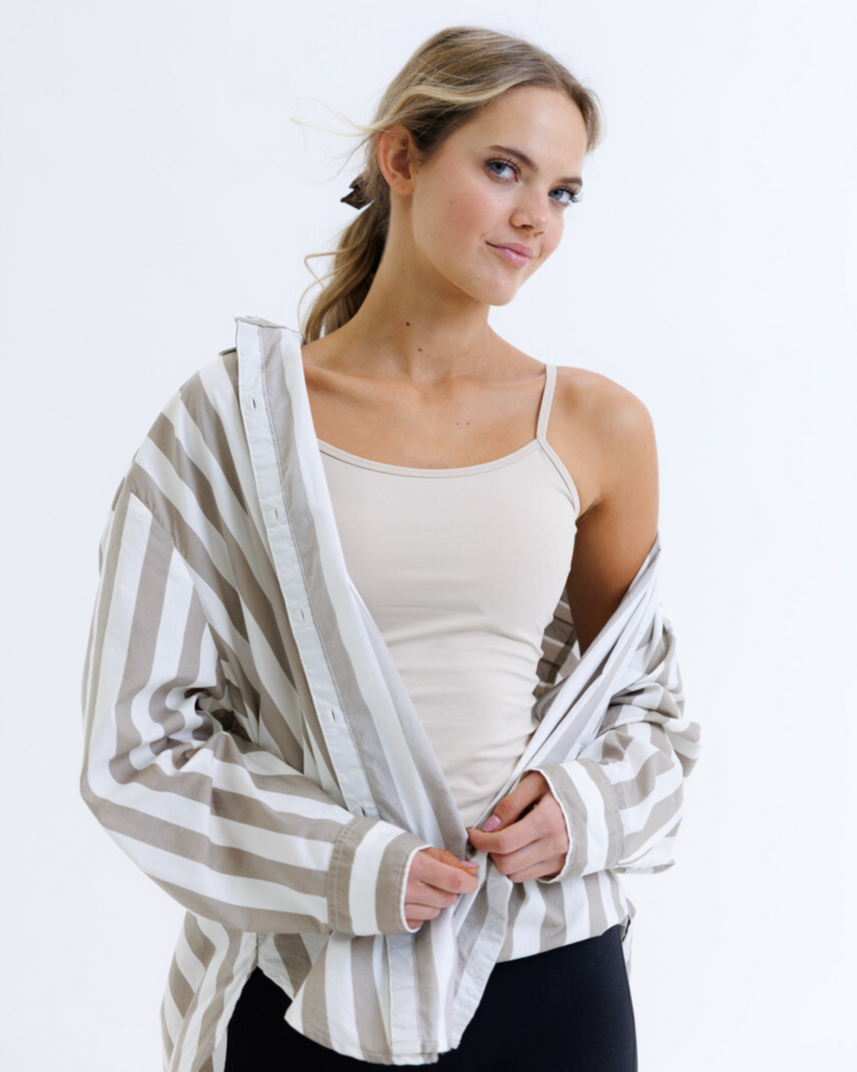 White Downeast Wonder Cami tee displayed on a model, showcasing its comfortable fit and simple design.