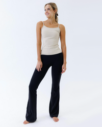 White Downeast Wonder Cami T-shirt displayed flat, showing its soft fabric and simple, comfortable design.