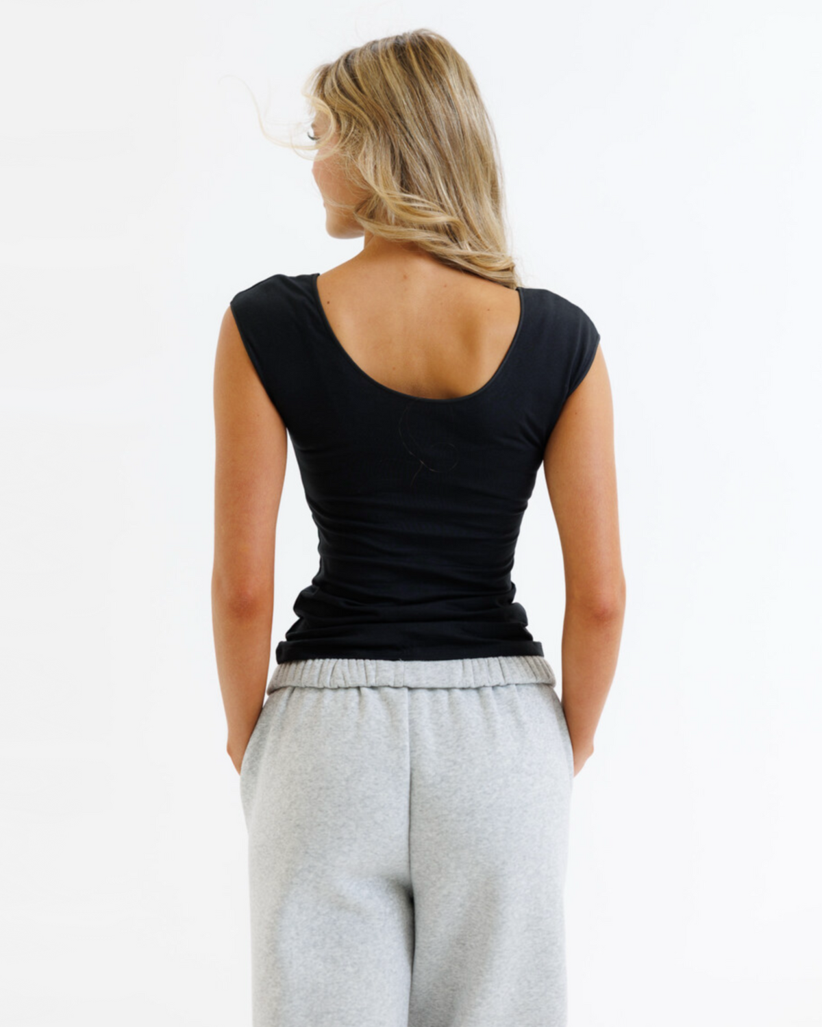 White Downeast Wonder Tee for women, featuring a classic fit and soft cotton fabric, shown laid flat.