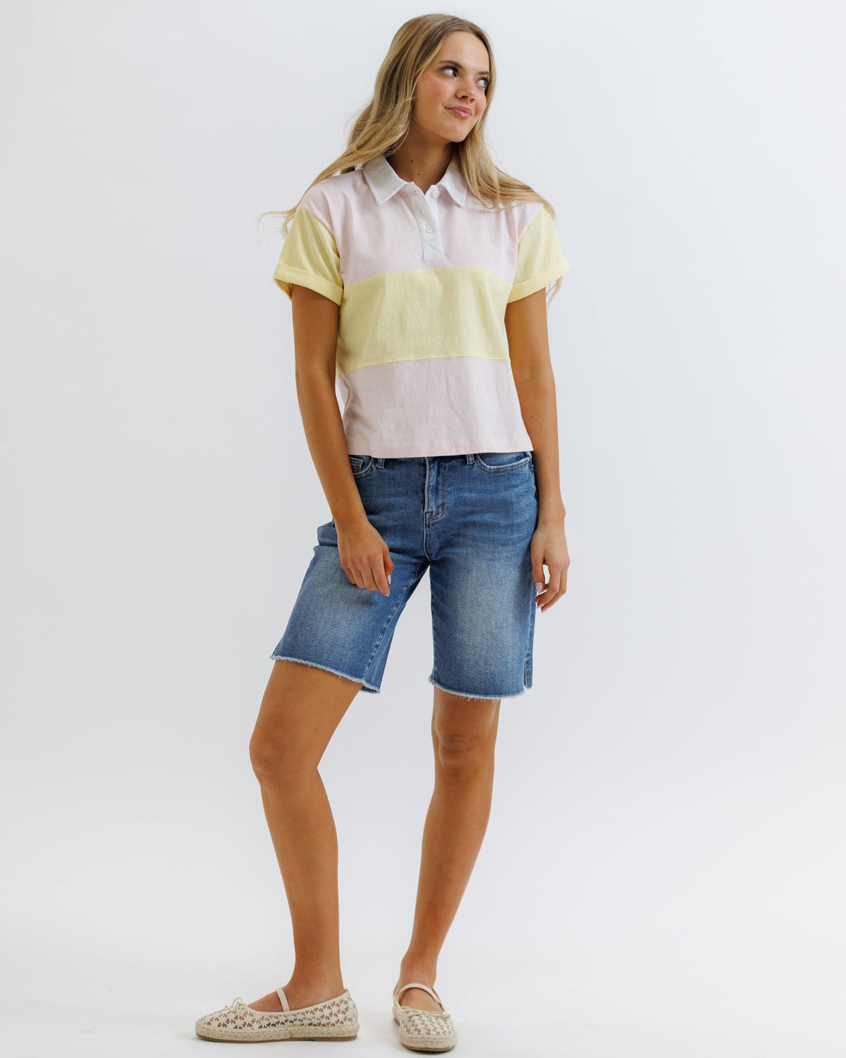 Downeast rugby tee, casual tops with a classic design, featuring a comfortable fit and athletic style in a natural pose.