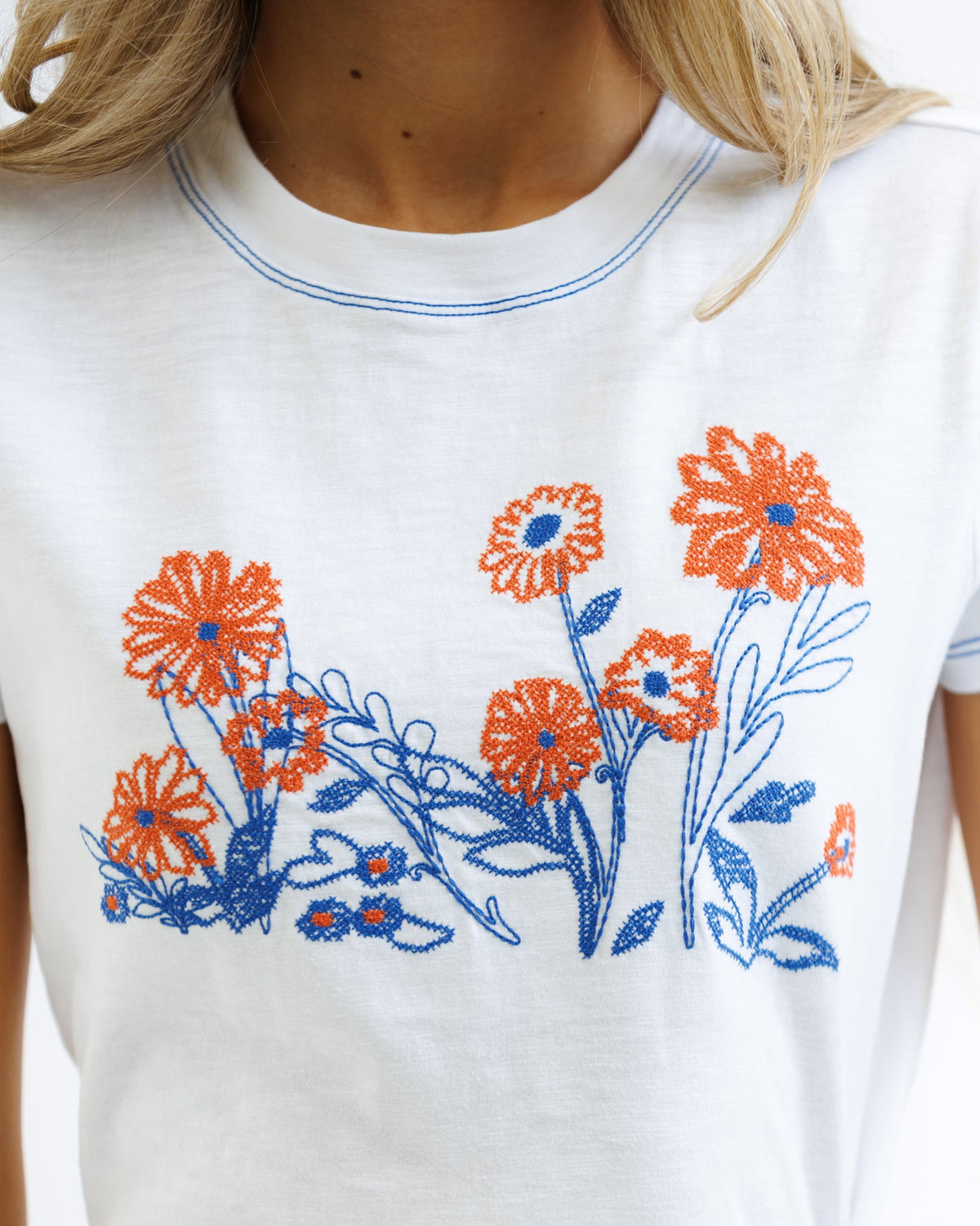 Downeast cross stitch tee shirt featuring colorful embroidery on soft cotton fabric, casual top for everyday wear.