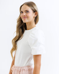 Light pink Beyond Basic top by Downeast, featuring a relaxed fit and soft fabric, displayed on a white background.