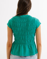 Downeast smocked tee top featuring a fitted, ruffled design with short sleeves and a relaxed, stylish fit.