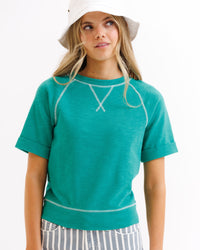 Green vintage Downeast Team Crew top for women, featuring a classic crewneck design and soft fabric.