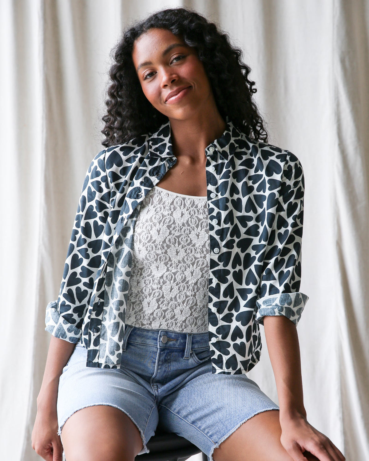 Downeast More Love top in XS featuring a heart pattern, stylish long-sleeve blouse with a feminine fit.