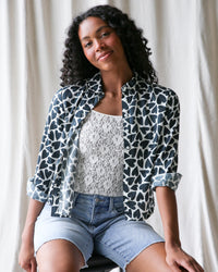 Downeast More Love top in XS featuring a heart pattern, stylish long-sleeve blouse with a feminine fit.