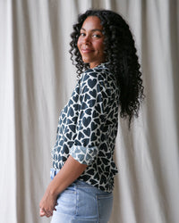 Downeast More Love Top in XS, featuring a stylish design with heart details, perfect for casual wear.