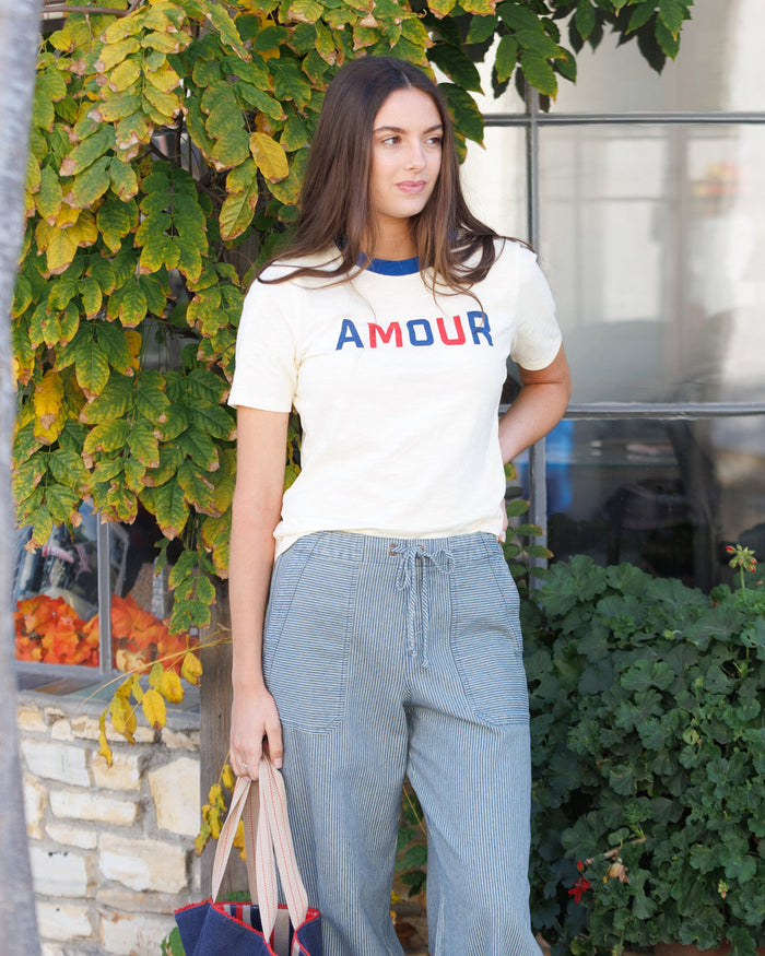 Downeast We Love It Tee in lemon icing color, casual tops, lightweight cotton fabric, front graphic design, XS size.