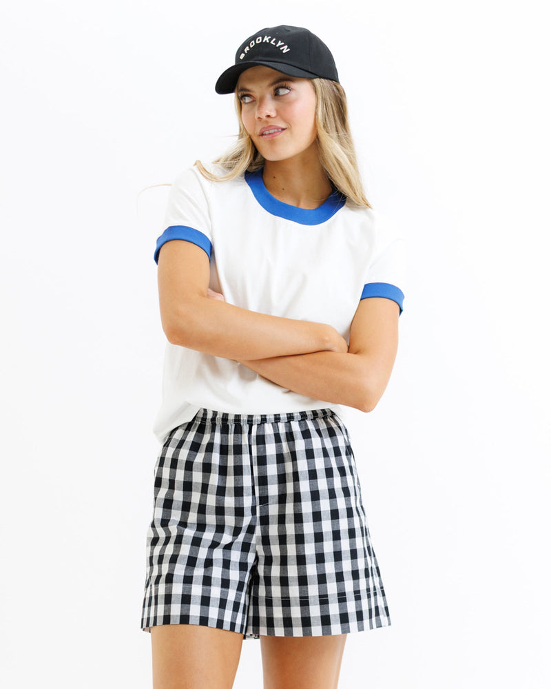 Downeast ringer tee top with contrasting collar and sleeves, soft fabric, and classic fit, shown in a casual style.