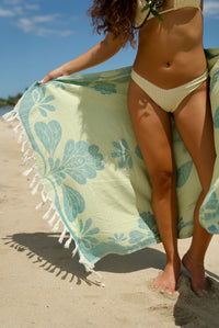 EHA Culture Naupaka Dreams luxurious towel with intricate floral pattern, soft fabric, and elegant design in natural colors.