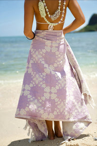 EHA Culture Pua Kalaunu luxurious beach towel with vibrant floral pattern and soft, plush fabric for beach and pool use.