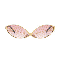 Gold leaf from Exclusive Eyes Inc, showcasing delicate, shimmering gold leaf sheets for decorative or craft use.