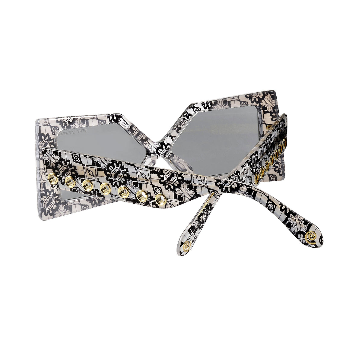 Close-up of Madame X sunglasses from Exclusive Eyes Inc., showcasing sleek black frames and tinted lenses.