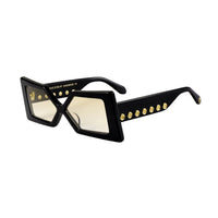Elegant pair of Madame X eyeglasses by Exclusive Eyes Inc with sleek black frames and clear lenses.
