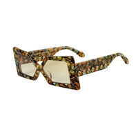 Elegant pair of Madame X eyeglasses from Exclusive Eyes Inc with clear lenses and sleek black frames.