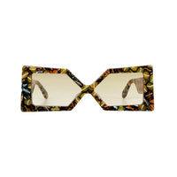 Elegant pair of Madame X eyeglasses by Exclusive Eyes Inc with sleek black frames and clear lenses.