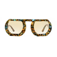 Close-up of the THOTH eyeglasses from EXCLUSIVE EYES INC, showcasing sleek black frames and clear lenses.