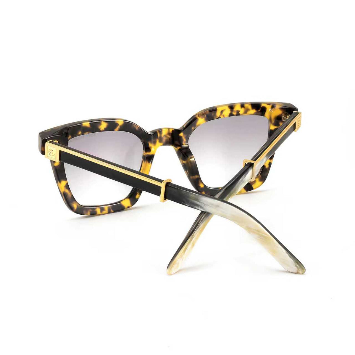 Black Master Flash sunglasses with blue light lenses by Exclusive Eyes Inc, featuring sleek design and tinted blue lenses.