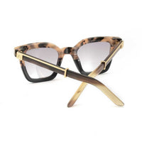 Black Master Flash sunglasses with blue light lenses by EXCLUSIVE EYES INC, featuring sleek design and tinted blue lenses.
