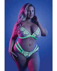 Glow night vision bralette and cage panty rave outfit set by Festival Drip, with glowing accents and a stylish, edgy design.
