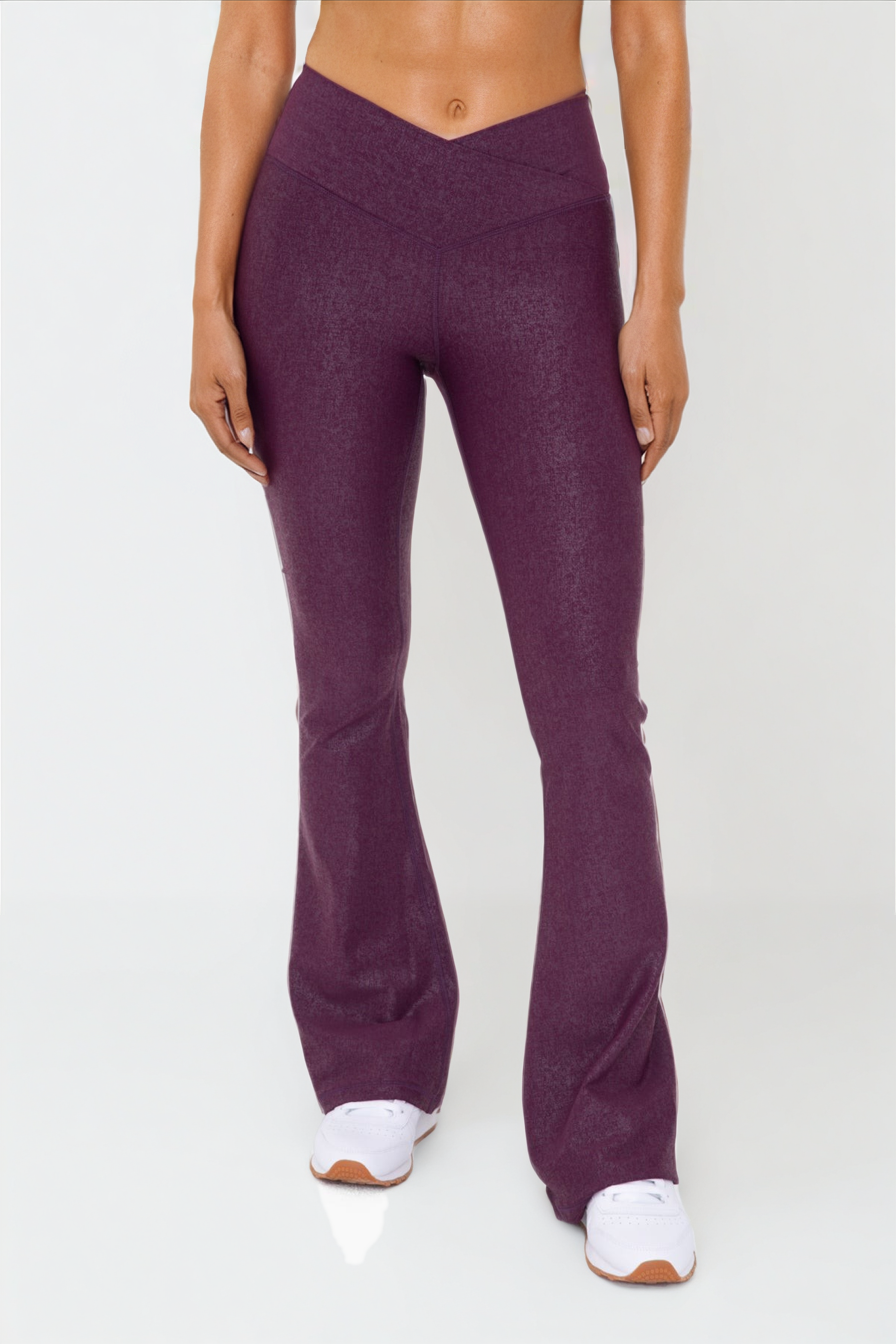Black Luxe Edge leather-look crossover flare leggings by Fitkitty Culture, designed for stylish women's athleisure and yoga wear.
