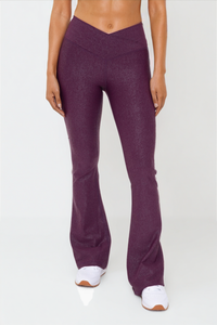 Black Luxe Edge leather-look crossover flare leggings by Fitkitty Culture, designed for stylish women's athleisure and yoga wear.