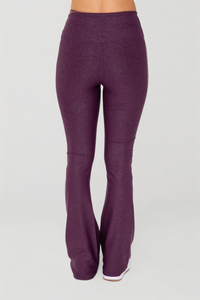 Black Luxe Edge leather-look crossover flare leggings by Fitkitty Culture, stylish women's athleisure and yoga clothing.