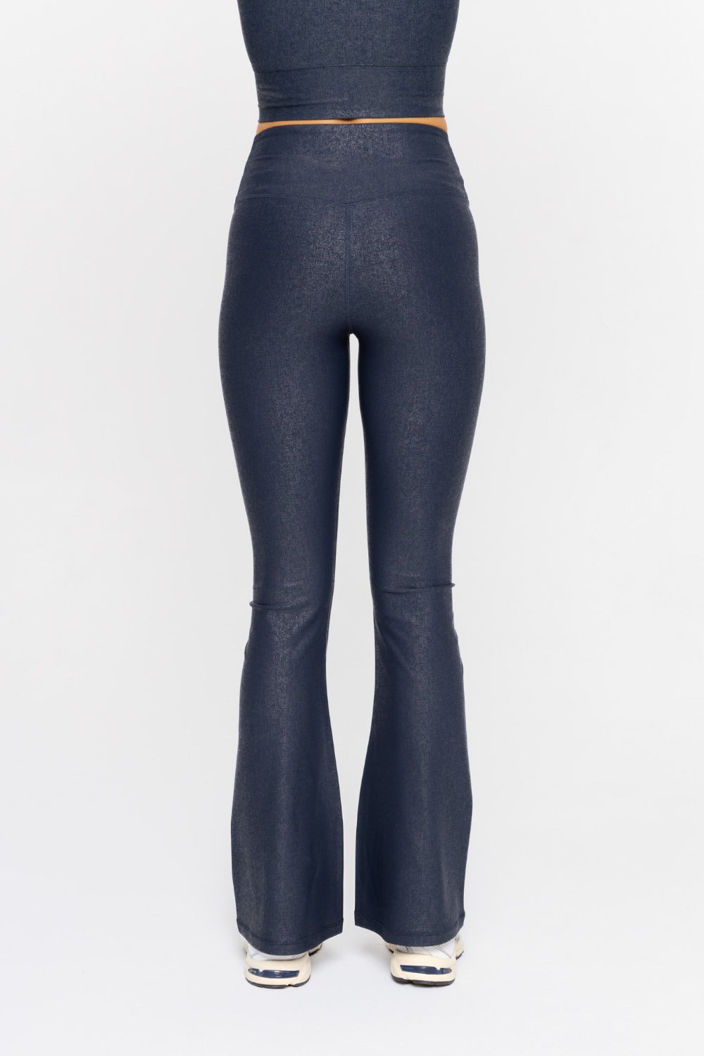Black Luxe Edge leather-look crossover flare leggings by Fitkitty Culture, showcasing a sleek, stylish design for women's athleisure wear.