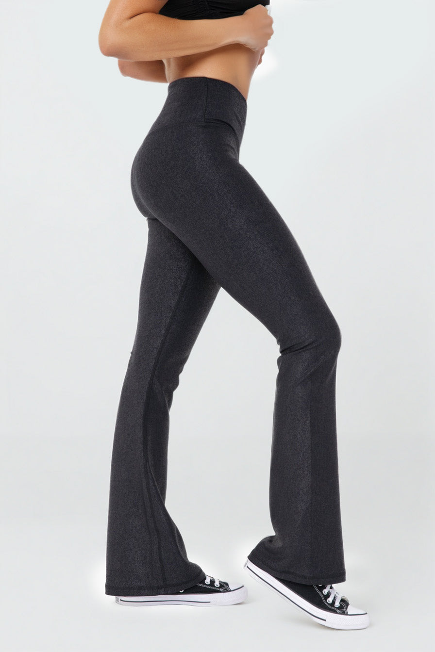 Black Luxe Edge leather-look crossover flare leggings by Fitkitty Culture Athleisure Wear, designed for stylish women’s activewear.