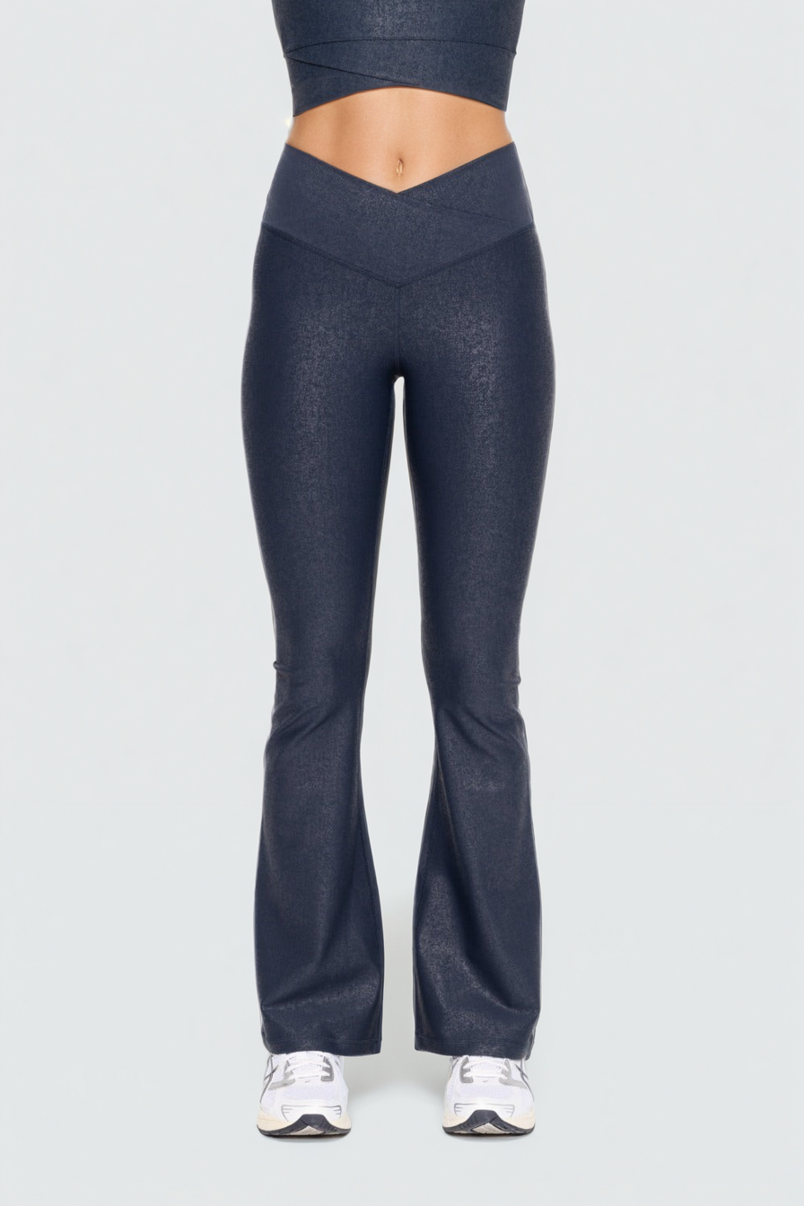 Black Luxe Edge leather-look crossover flare leggings by Fitkitty Culture, stylish women's athletic and yoga clothing.