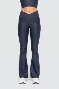 Black Luxe Edge leather-look crossover flare leggings by Fitkitty Culture, stylish women's athletic and yoga clothing.