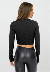 Black Luxe Edge leather-look crossover flare leggings from Fitkitty Culture Athleisure Wear, perfect for yoga and casual wear.