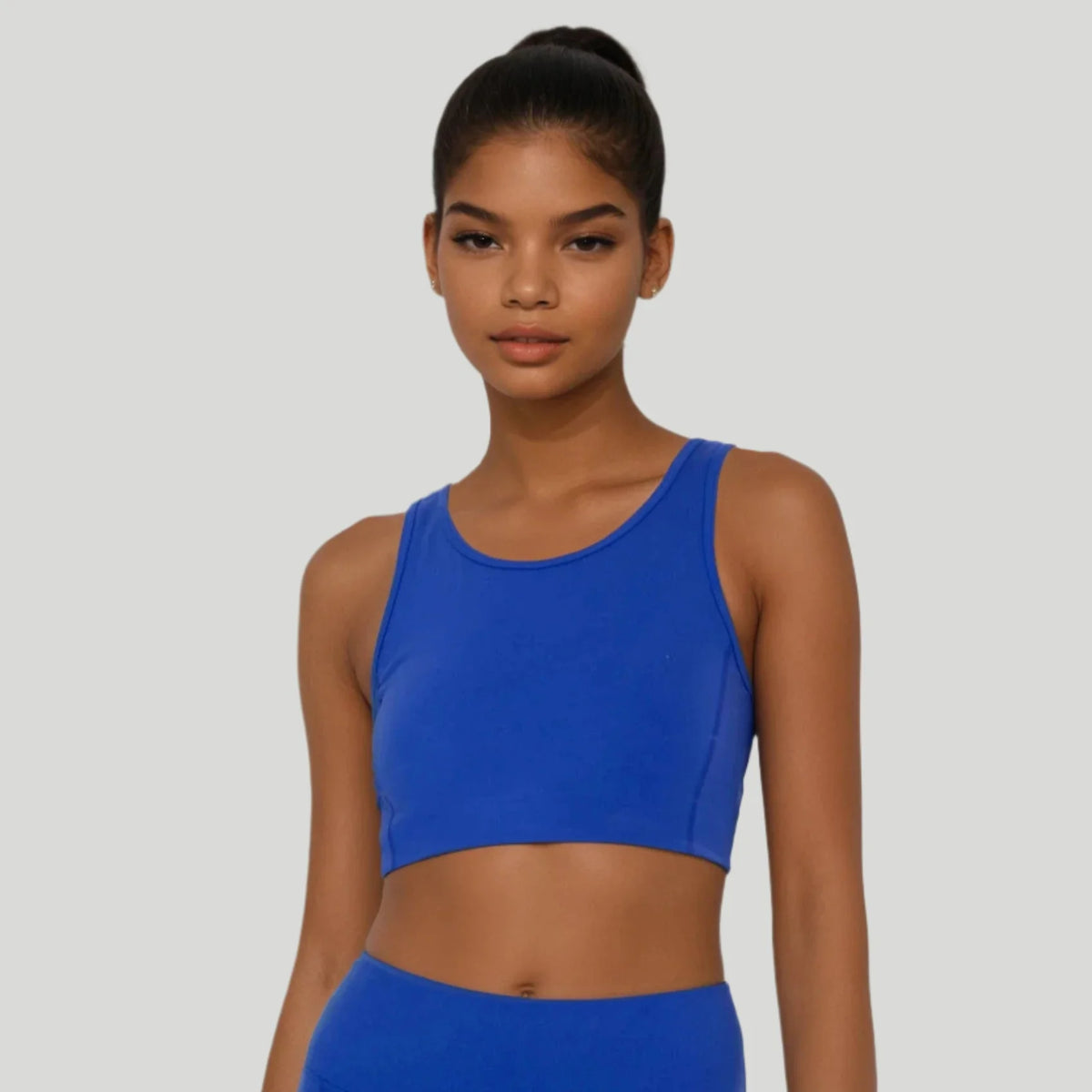 Blue Breathe Easy Cut-Out Back Sports Bra by Fitkitty Culture, made of Lycra® blend, designed for active women’s yoga and workout wear.