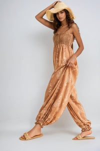 Wildflower Dreams Balloon Jumpsuit by Fitkitty Culture, stylish women's clothing with a colorful floral pattern and relaxed fit.