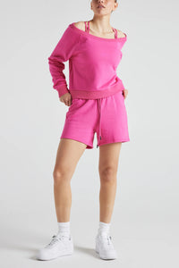 Pink off-shoulder sweatshirt from Fitkitty Culture athleisure wear, stylish women’s clothing perfect for casual or yoga outfits.